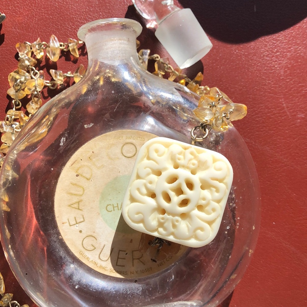 Ivory styled necklace with beige and tan beads.